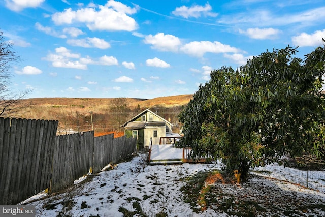 view of front of property featuring a wooden deck