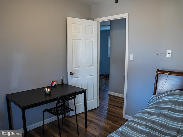 bedroom featuring dark wood-type flooring