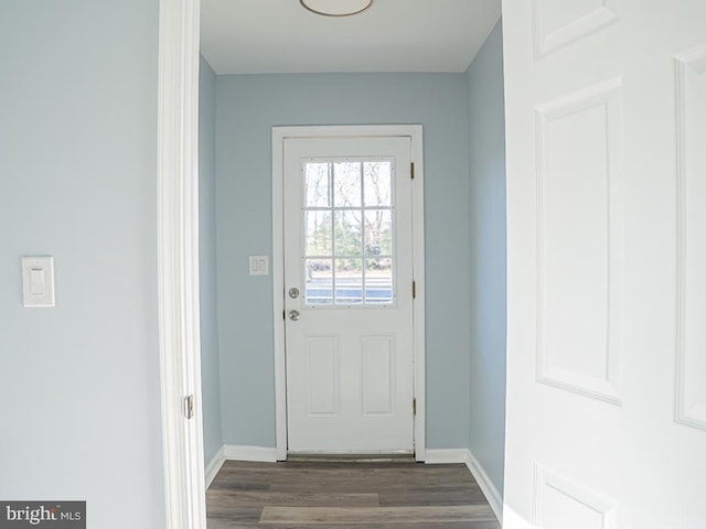 doorway to outside featuring dark wood-type flooring