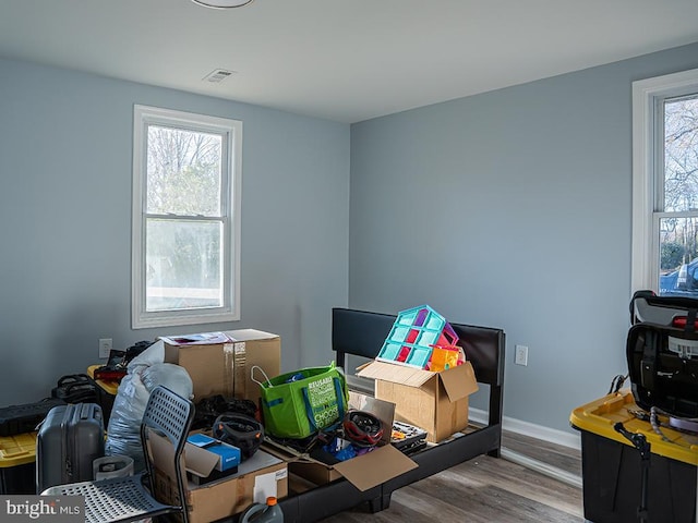 home office featuring hardwood / wood-style floors and plenty of natural light