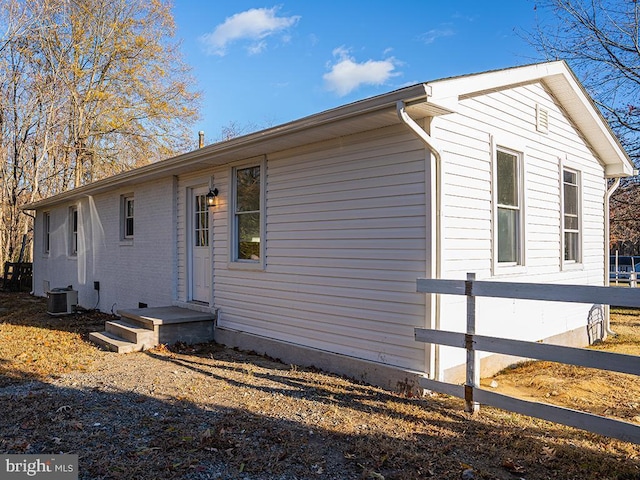 view of property exterior with central AC