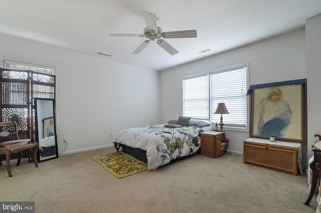 bedroom featuring ceiling fan and light carpet