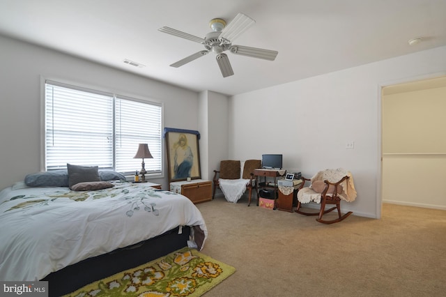 bedroom featuring ceiling fan and light colored carpet