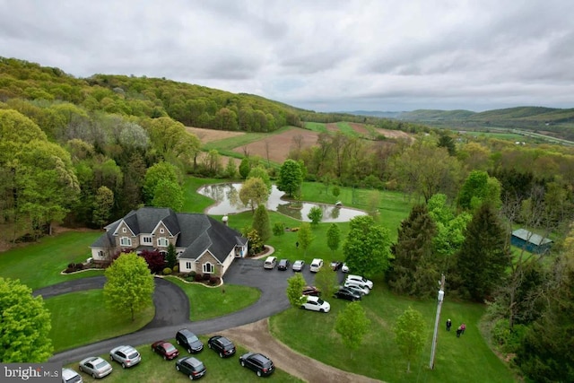 bird's eye view featuring a forest view