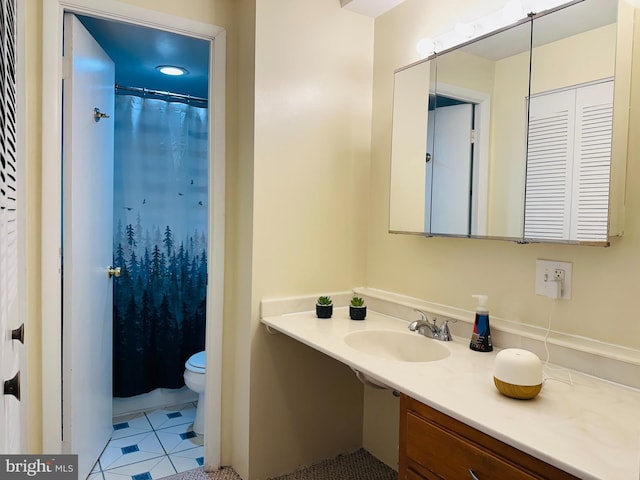 bathroom with walk in shower, sink, tile patterned flooring, and toilet