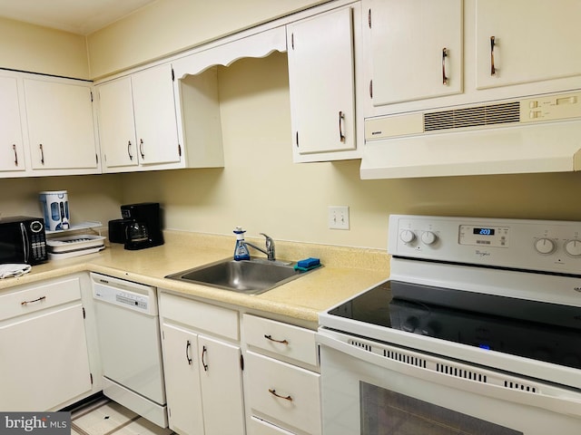 kitchen with sink, white appliances, white cabinetry, and exhaust hood