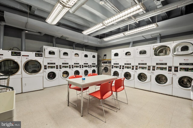 laundry area featuring washing machine and dryer and stacked washer / drying machine