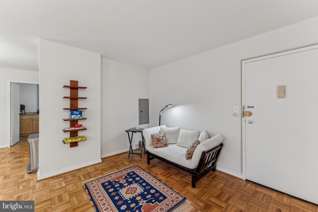 sitting room with electric panel and parquet floors