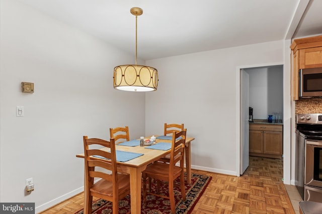 dining room with light parquet flooring