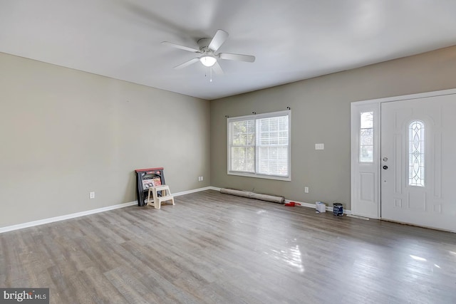 entrance foyer with ceiling fan and light wood-type flooring