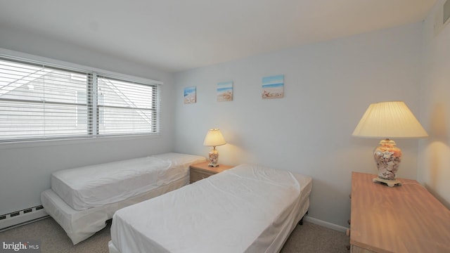 bedroom with carpet flooring and baseboard heating