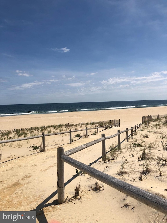 view of water feature with a beach view