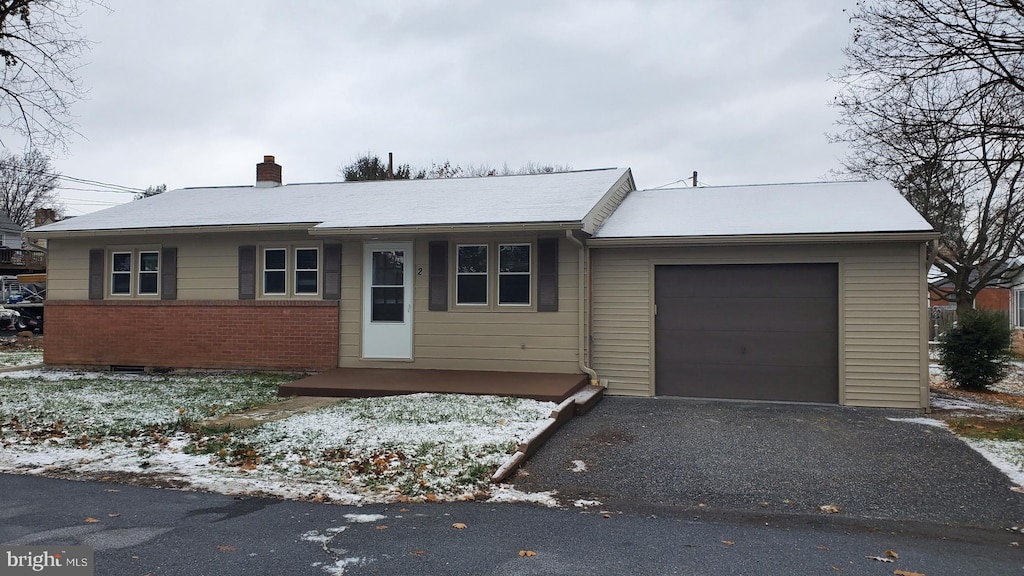 single story home with a garage