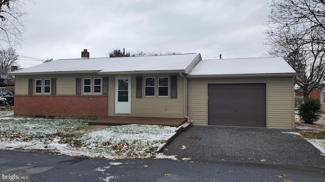 single story home with a garage