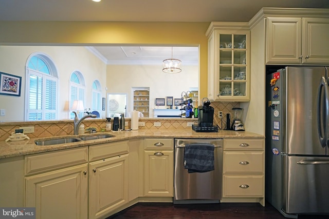 kitchen with backsplash, dark wood-type flooring, sink, appliances with stainless steel finishes, and light stone counters