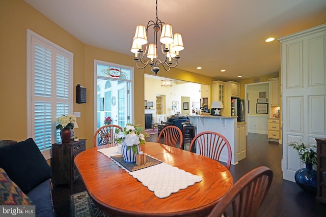 dining room featuring a chandelier and dark hardwood / wood-style floors