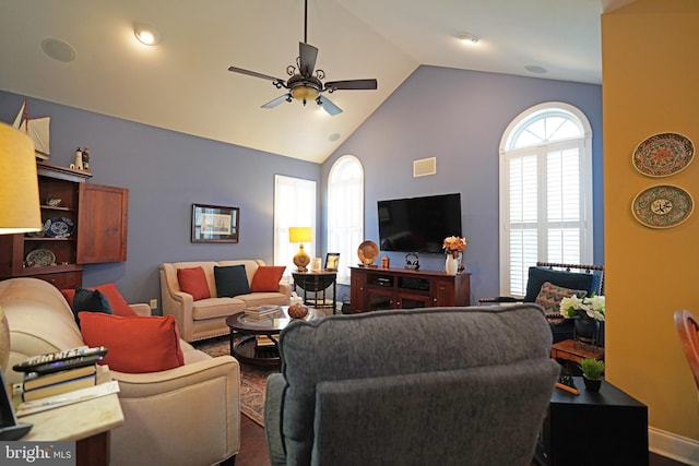 living room with hardwood / wood-style flooring, vaulted ceiling, and ceiling fan