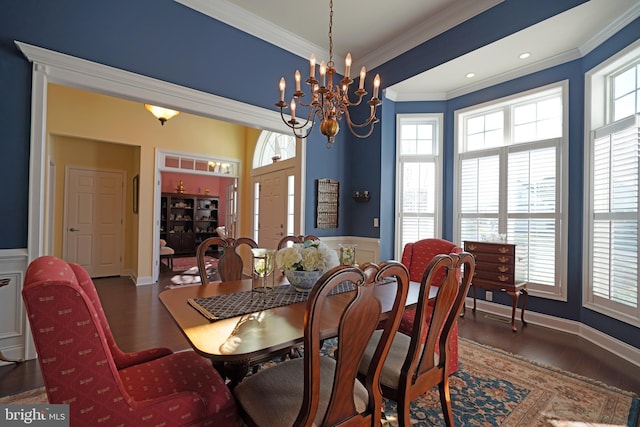 dining room featuring dark hardwood / wood-style floors, an inviting chandelier, and plenty of natural light