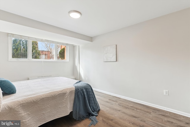 bedroom featuring hardwood / wood-style flooring