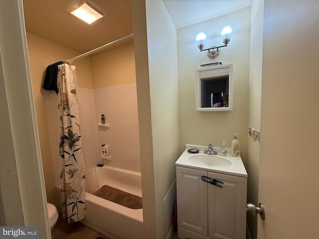 full bathroom with toilet, vanity, and shower / tub combo with curtain