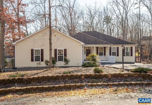 single story home featuring a porch