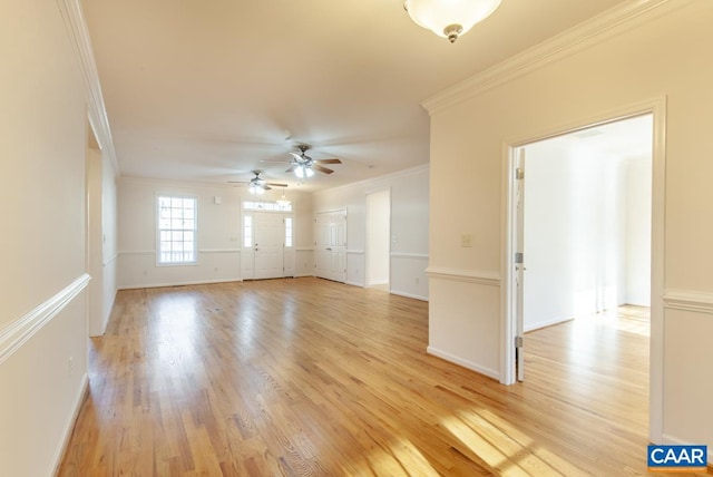 empty room with light hardwood / wood-style flooring, ceiling fan, and ornamental molding