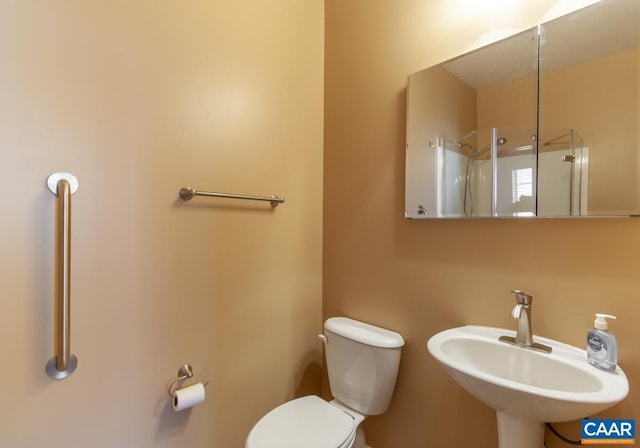 bathroom with toilet and sink