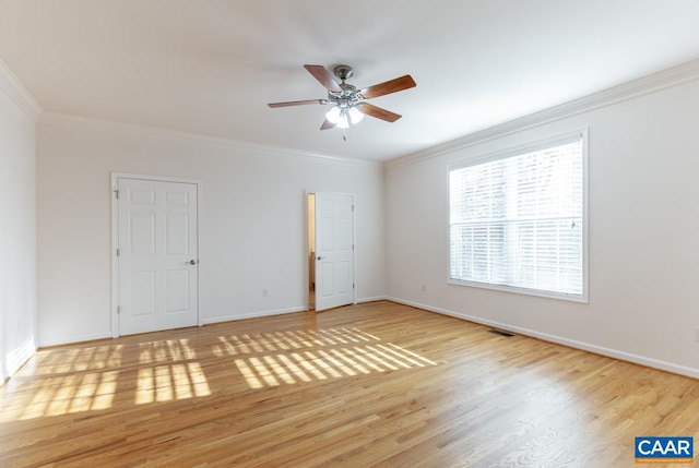 unfurnished room with ceiling fan, crown molding, and light hardwood / wood-style flooring