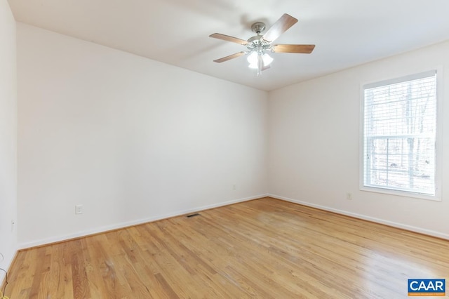 spare room with ceiling fan and light hardwood / wood-style flooring