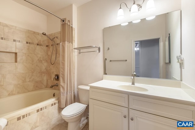 full bathroom with vanity, shower / bath combination with curtain, and toilet