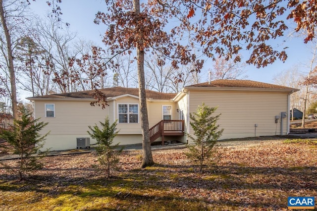 back of house featuring central AC unit