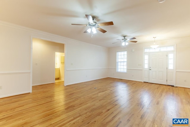 interior space featuring light hardwood / wood-style flooring, ceiling fan, and ornamental molding