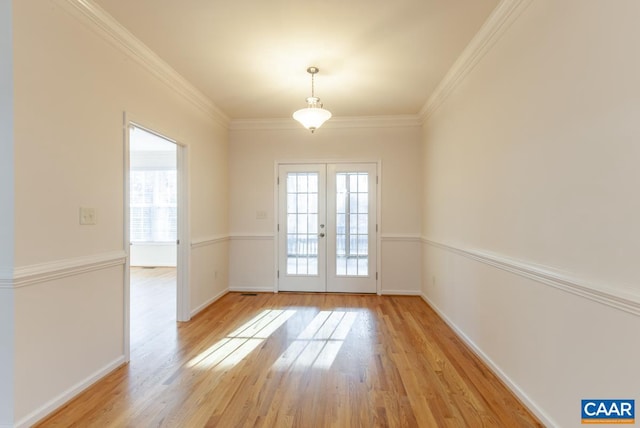 doorway to outside with french doors, light hardwood / wood-style flooring, and crown molding