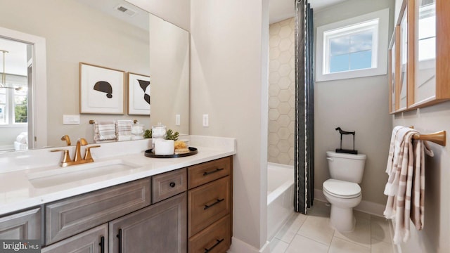 full bathroom featuring tile patterned flooring, shower / tub combo, vanity, and toilet