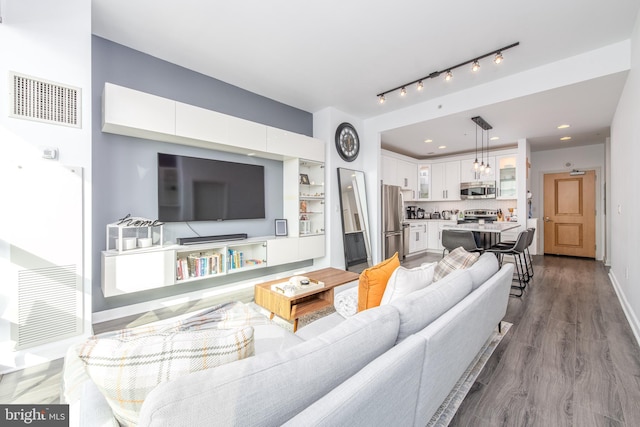 living room with light hardwood / wood-style flooring