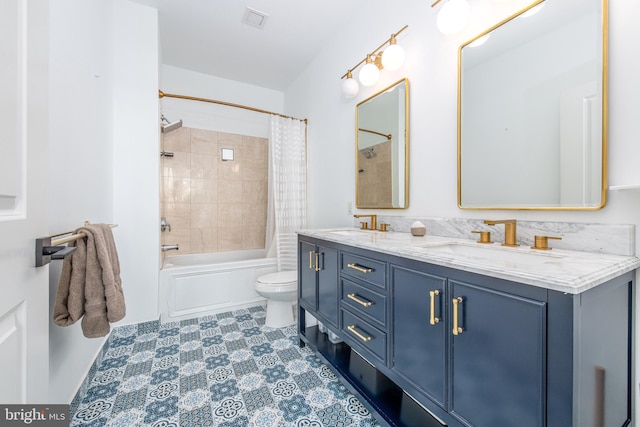 full bathroom featuring vanity, toilet, and shower / tub combo with curtain