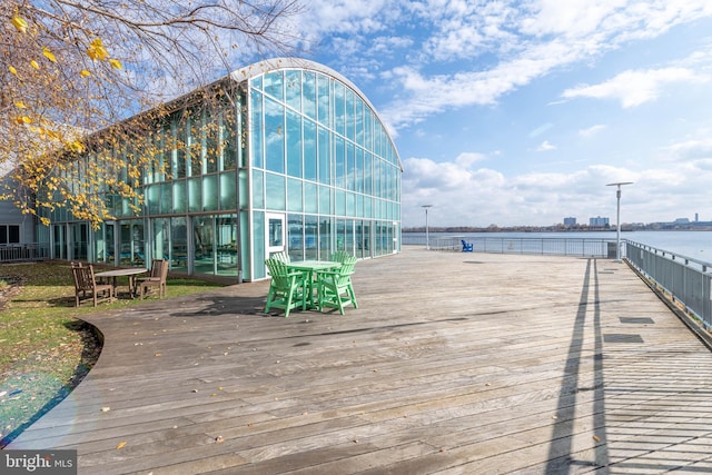 wooden deck with a water view