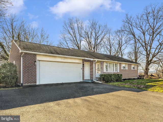 ranch-style home with a garage