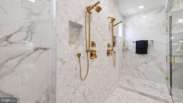 bathroom with an enclosed shower