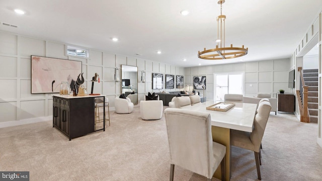 dining area with light colored carpet