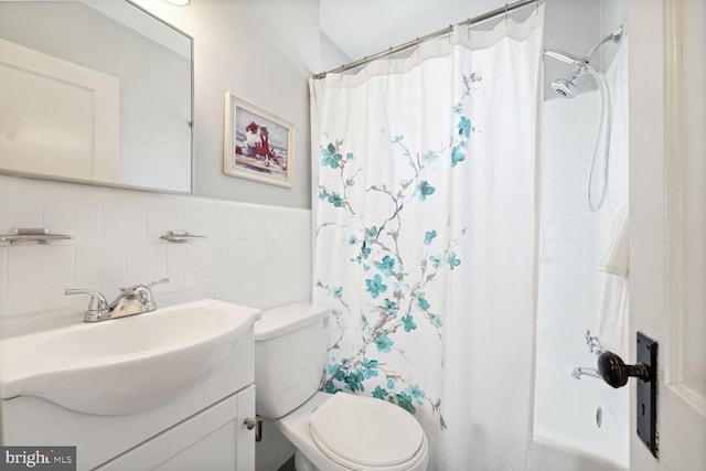 full bathroom with shower / bath combination with curtain, tasteful backsplash, vanity, tile walls, and toilet