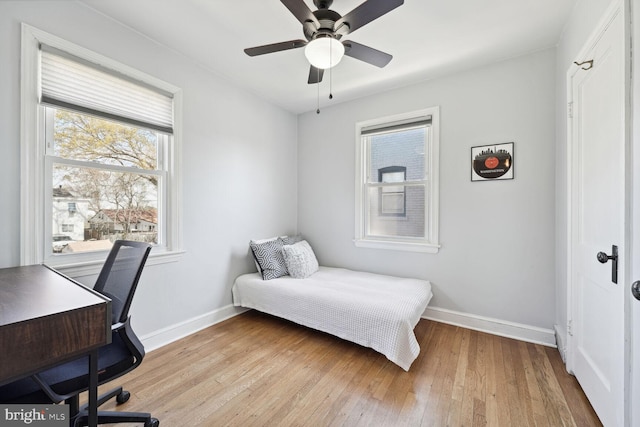 bedroom with light wood-type flooring and ceiling fan