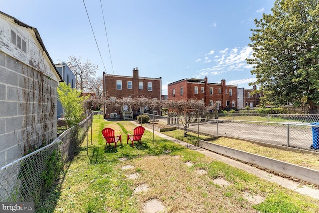 view of property's community featuring a yard