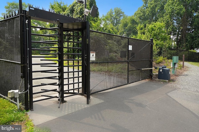 view of gate with fence