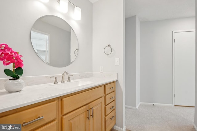 bathroom featuring vanity and baseboards