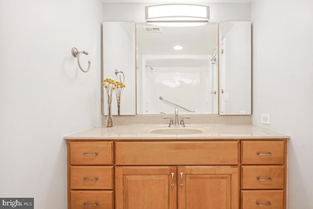 bathroom featuring vanity and visible vents