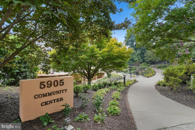 view of home's community featuring fence