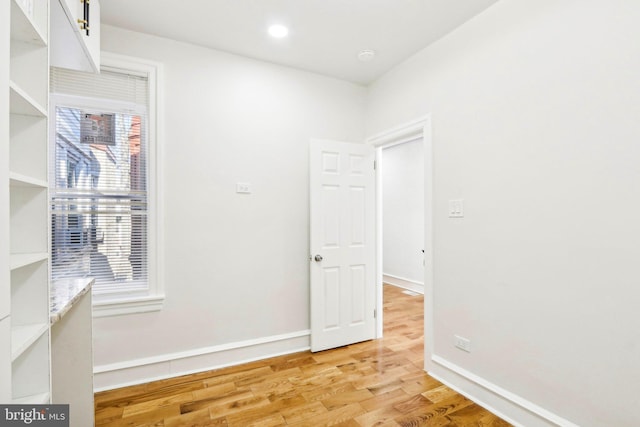 unfurnished room featuring light wood-type flooring