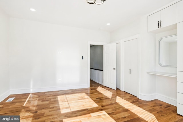 spare room with light hardwood / wood-style floors