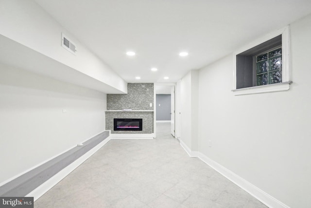 basement featuring a large fireplace